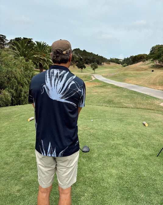 Golfer in Volpe Polo preparing for their next tee shot