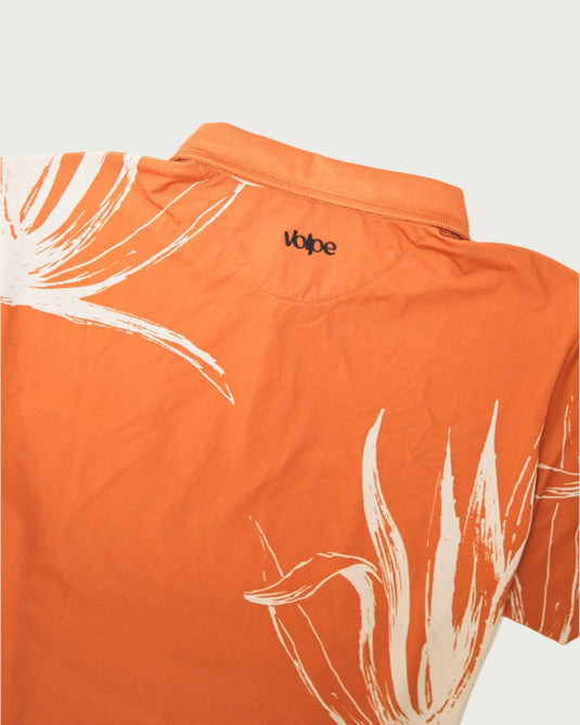 A medium close up of a Volpe rust polo