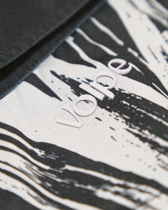 Close up of the Volpe logo on the back of a polo