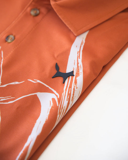 Close up of logo on a Volpe golf polo