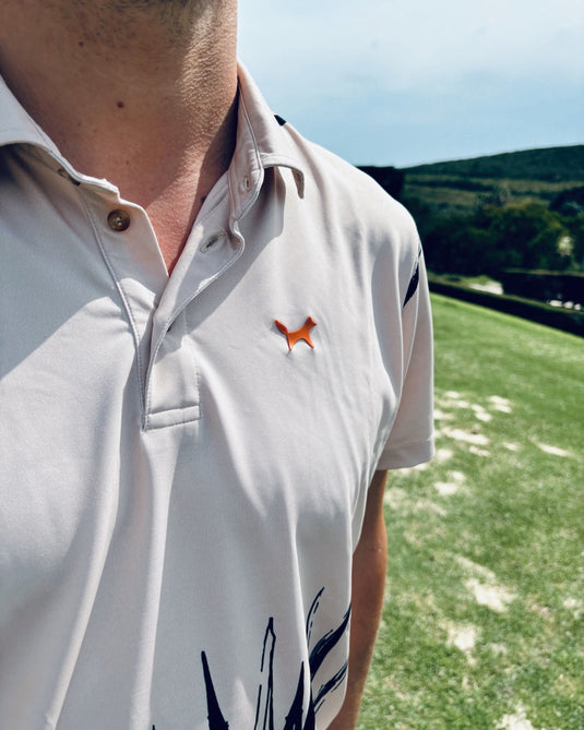 Close up of a Volpe polo with focus on the logo on front left chest